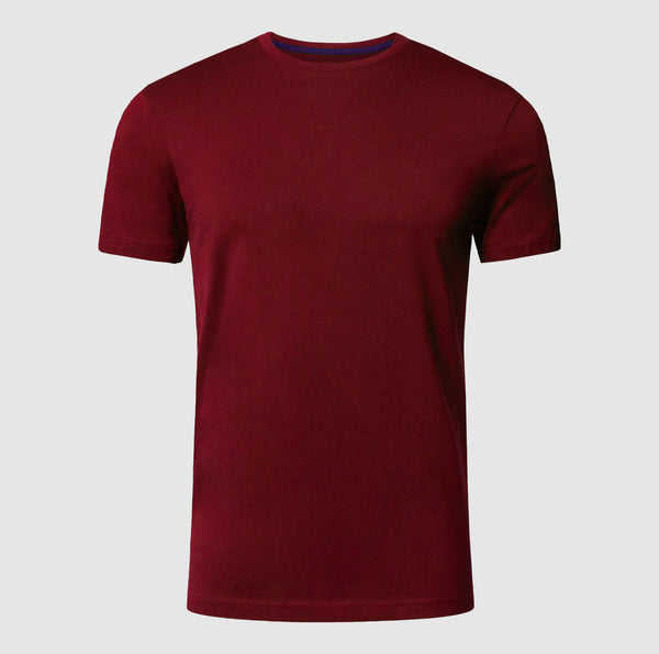 Maroon t-shirt on a light gray background

